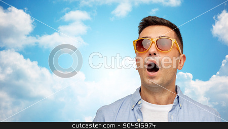 To use this stock image in your creative project, please select the size you need over to the right and click the "Add to Cart" button.
Your downloaded image will come with the Cutcaster watermark removed so don’t worry about the watermark you see on this page. face of scared man in shirt and sunglasses stock photo, summer, emotions, style and people concept - face of scared or surprised middle aged latin man in shirt and sunglasses over blue sky and clouds background by Syda Productions