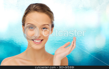 To use this stock image in your creative project, please select the size you need over to the right and click the "Add to Cart" button.
Your downloaded image will come with the Cutcaster watermark removed so don’t worry about the watermark you see on this page. smiling young woman face and shoulders stock photo, beauty, people and health concept - smiling young woman face and shoulders by Syda Productions