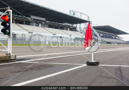 To use this stock image in your creative project, please select the size you need over to the right and click the "Add to Cart" button.
Your downloaded image will come with the Cutcaster watermark removed so don’t worry about the watermark you see on this page. red traffic lights and road sign on race track stock photo, motosports, extreme and race concept - close up of red traffic lights and road sign with flag on speedway track or road by Syda Productions