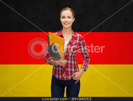 To use this stock image in your creative project, please select the size you need over to the right and click the "Add to Cart" button.
Your downloaded image will come with the Cutcaster watermark removed so don’t worry about the watermark you see on this page. happy student girl with tablet pc and folders stock photo, people, education, learning and school concept - happy and smiling teenage student girl with tablet pc and folders over german flag background by Syda Productions