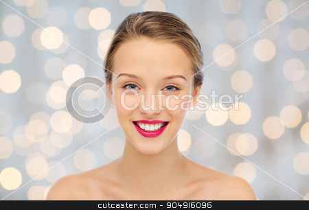 To use this stock image in your creative project, please select the size you need over to the right and click the "Add to Cart" button.
Your downloaded image will come with the Cutcaster watermark removed so don’t worry about the watermark you see on this page. smiling young woman face and shoulders stock photo, beauty, people and health concept - smiling young woman face with pink lipstick on lips and shoulders over holidays lights background by Syda Productions