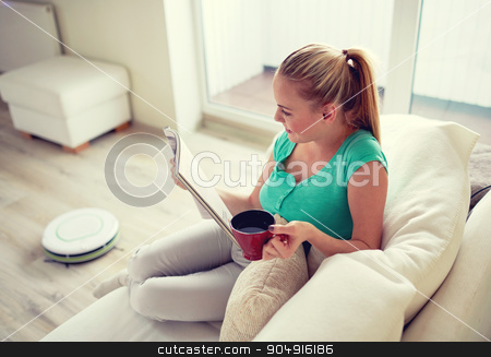 To use this stock image in your creative project, please select the size you need over to the right and click the "Add to Cart" button.
Your downloaded image will come with the Cutcaster watermark removed so don’t worry about the watermark you see on this page. happy woman reading magazine with tea cup at home stock photo, people, leisure, household and technology concept - happy woman reading magazine and drinking tea while robot vacuum cleaning floor at home by Syda Productions