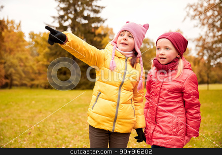 To use this stock image in your creative project, please select the size you need over to the right and click the "Add to Cart" button.
Your downloaded image will come with the Cutcaster watermark removed so don’t worry about the watermark you see on this page. happy little girls pointing finger in autumn park stock photo, autumn, childhood, leisure, gesture and people concept - happy little girls pointing finger in park outdoors by Syda Productions