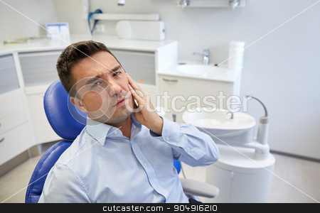 To use this stock image in your creative project, please select the size you need over to the right and click the "Add to Cart" button.
Your downloaded image will come with the Cutcaster watermark removed so don’t worry about the watermark you see on this page. man having toothache and sitting on dental chair stock photo, people, medicine, stomatology and health care concept - unhappy male patient having toothache sitting on dental chair at clinic office by Syda Productions