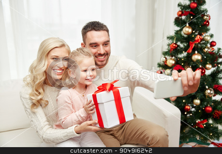 To use this stock image in your creative project, please select the size you need over to the right and click the "Add to Cart" button.
Your downloaded image will come with the Cutcaster watermark removed so don’t worry about the watermark you see on this page. family taking selfie with smartphone at christmas stock photo, christmas, holidays, technology and people concept - happy family sitting on sofa and taking selfie picture with smartphone at home by Syda Productions