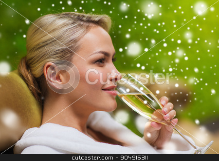 To use this stock image in your creative project, please select the size you need over to the right and click the "Add to Cart" button.
Your downloaded image will come with the Cutcaster watermark removed so don’t worry about the watermark you see on this page. beautiful young woman drinking champagne at spa stock photo, people, beauty, lifestyle, holidays and relaxation concept - beautiful young woman in white bath robe lying on chaise-longue and drinking champagne at spa with snow effect by Syda Productions