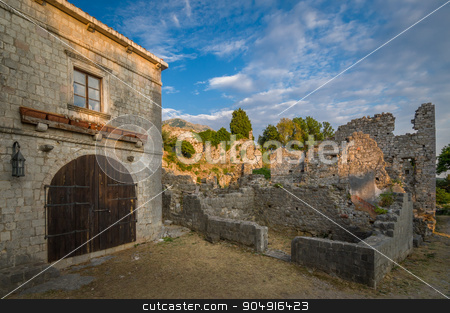 To use this stock image in your creative project, please select the size you need over to the right and click the "Add to Cart" button.
Your downloaded image will come with the Cutcaster watermark removed so don’t worry about the watermark you see on this page. Stari Bar fortress buildings, Montenegro stock photo, Old Town of Bar medieval fortress building with wooden gate and wall ruins, Montenegro by Alexander Nikiforov