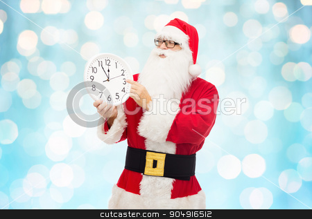 To use this stock image in your creative project, please select the size you need over to the right and click the "Add to Cart" button.
Your downloaded image will come with the Cutcaster watermark removed so don’t worry about the watermark you see on this page. man in costume of santa claus with clock stock photo, christmas, holidays, time and people concept - man in costume of santa claus with clock showing twelve pointing finger over blue holidays lights background by Syda Productions