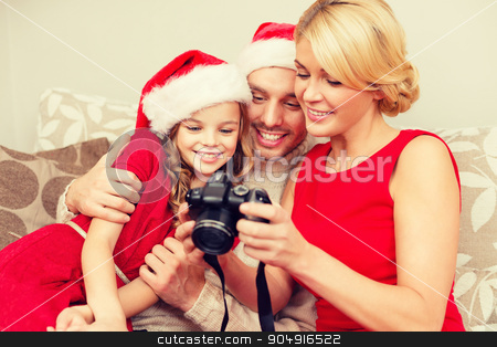 To use this stock image in your creative project, please select the size you need over to the right and click the "Add to Cart" button.
Your downloaded image will come with the Cutcaster watermark removed so don’t worry about the watermark you see on this page. family in santa helper hats looking at pictires stock photo, family, christmas, x-mas, happiness and people concept - smiling family in santa helper hats looking at pictures by Syda Productions