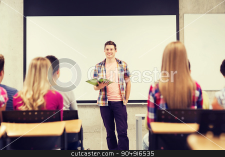 To use this stock image in your creative project, please select the size you need over to the right and click the "Add to Cart" button.
Your downloaded image will come with the Cutcaster watermark removed so don’t worry about the watermark you see on this page. group of smiling students in classroom stock photo, education, high school, teamwork and people concept - smiling student boy with notebook standing in front of students in classroom by Syda Productions