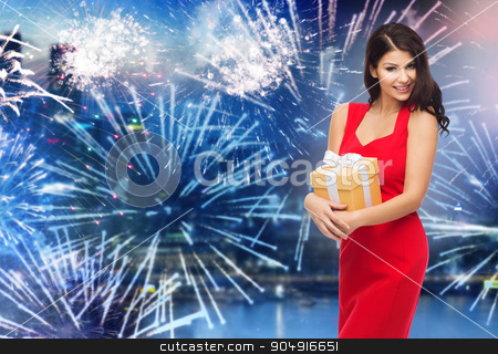 To use this stock image in your creative project, please select the size you need over to the right and click the "Add to Cart" button.
Your downloaded image will come with the Cutcaster watermark removed so don’t worry about the watermark you see on this page. happy woman in red dress with gift over firework stock photo, people, holidays, christmas, new year party and celebration concept - beautiful sexy woman in red dress with gift box over night city and firework background by Syda Productions