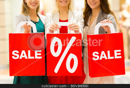 To use this stock image in your creative project, please select the size you need over to the right and click the "Add to Cart" button.
Your downloaded image will come with the Cutcaster watermark removed so don’t worry about the watermark you see on this page. close up of happy women with shopping bags in mall stock photo, consumerism and people concept - close up of happy young women holding shopping bags with sale and percentage sign in mall by Syda Productions