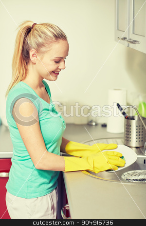 To use this stock image in your creative project, please select the size you need over to the right and click the "Add to Cart" button.
Your downloaded image will come with the Cutcaster watermark removed so don’t worry about the watermark you see on this page. happy woman washing dishes at home kitchen stock photo, people, housework and housekeeping concept - happy woman in protective gloves washing dishes at home kitchen by Syda Productions