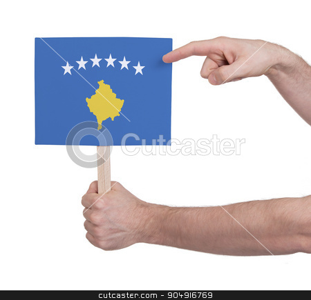 To use this stock image in your creative project, please select the size you need over to the right and click the "Add to Cart" button.
Your downloaded image will come with the Cutcaster watermark removed so don’t worry about the watermark you see on this page. Hand holding small card - Flag of Kosovo stock photo, Hand holding small card, isolated on white - Flag of Kosovo by michaklootwijk
