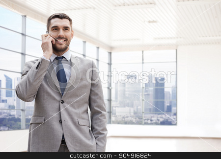 To use this stock image in your creative project, please select the size you need over to the right and click the "Add to Cart" button.
Your downloaded image will come with the Cutcaster watermark removed so don’t worry about the watermark you see on this page. happy young businessman calling on smartphone stock photo, business, people and office concept - happy young businessman calling on smartphone over office room or new apartment background by Syda Productions