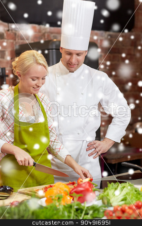 To use this stock image in your creative project, please select the size you need over to the right and click the "Add to Cart" button.
Your downloaded image will come with the Cutcaster watermark removed so don’t worry about the watermark you see on this page. happy male chef cook with woman cooking in kitchen stock photo, cooking class, culinary, food and people concept - happy male chef cook with woman cooking in kitchen over snow effect by Syda Productions
