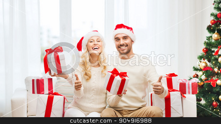 To use this stock image in your creative project, please select the size you need over to the right and click the "Add to Cart" button.
Your downloaded image will come with the Cutcaster watermark removed so don’t worry about the watermark you see on this page. happy couple with christmas gifts and thumbs up stock photo, christmas, holidays and people concept - happy couple in santa hats with gift boxes sitting on sofa and showing thumbs up at home by Syda Productions