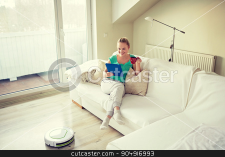 To use this stock image in your creative project, please select the size you need over to the right and click the "Add to Cart" button.
Your downloaded image will come with the Cutcaster watermark removed so don’t worry about the watermark you see on this page. happy woman with tablet pc drinking tea at home stock photo, people, housework and technology concept - happy woman with tablet pc computer and robot vacuum cleaner drinking tea at home by Syda Productions