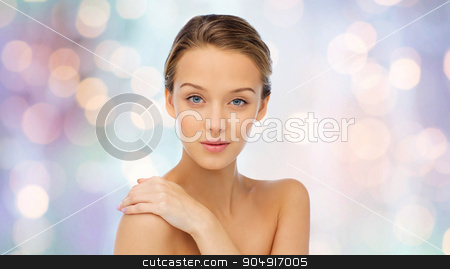 To use this stock image in your creative project, please select the size you need over to the right and click the "Add to Cart" button.
Your downloaded image will come with the Cutcaster watermark removed so don’t worry about the watermark you see on this page. smiling young woman face and shoulders stock photo, beauty, people, body care and health concept - smiling young woman face and hand on bare shoulder over purple holidays lights background by Syda Productions