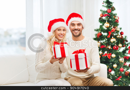 To use this stock image in your creative project, please select the size you need over to the right and click the "Add to Cart" button.
Your downloaded image will come with the Cutcaster watermark removed so don’t worry about the watermark you see on this page. happy couple at home with christmas gift boxes stock photo, christmas, holidays and people concept - happy couple in santa hats with gift boxes sitting on sofa at home by Syda Productions