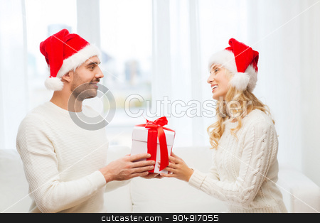 To use this stock image in your creative project, please select the size you need over to the right and click the "Add to Cart" button.
Your downloaded image will come with the Cutcaster watermark removed so don’t worry about the watermark you see on this page. happy couple at home with christmas gift box stock photo, christmas, holidays and people concept - happy couple in santa hats with gift box sitting on sofa at home by Syda Productions