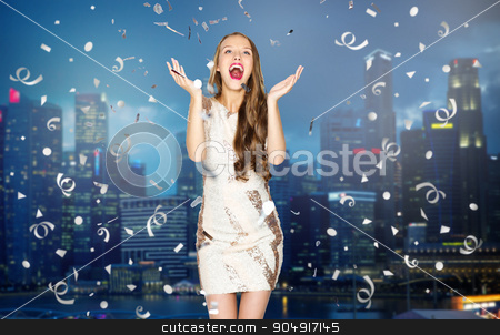 To use this stock image in your creative project, please select the size you need over to the right and click the "Add to Cart" button.
Your downloaded image will come with the Cutcaster watermark removed so don’t worry about the watermark you see on this page. happy young woman or teen girl over night city stock photo, people, holidays, emotion and glamour concept - happy young woman or teen girl in fancy dress with sequins and confetti at party over night singapore city background by Syda Productions