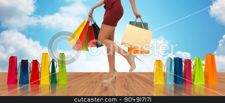 To use this stock image in your creative project, please select the size you need over to the right and click the "Add to Cart" button.
Your downloaded image will come with the Cutcaster watermark removed so don’t worry about the watermark you see on this page. close up of woman on high heels with shopping bags stock photo, people, sale and consumerism concept - close up of woman in red short skirt and high heeled shoes with shopping bags by Syda Productions