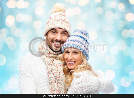 To use this stock image in your creative project, please select the size you need over to the right and click the "Add to Cart" button.
Your downloaded image will come with the Cutcaster watermark removed so don’t worry about the watermark you see on this page. happy couple in winter clothes hugging over lights stock photo, winter, fashion, couple, christmas and people concept - smiling man and woman in hats and scarf hugging over blue holidays lights background by Syda Productions
