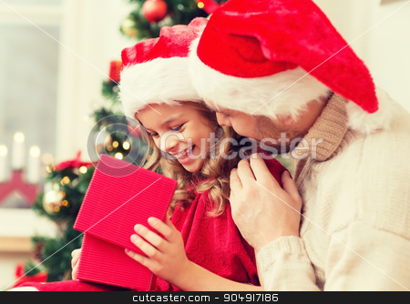 To use this stock image in your creative project, please select the size you need over to the right and click the "Add to Cart" button.
Your downloaded image will come with the Cutcaster watermark removed so don’t worry about the watermark you see on this page. smiling father and daughter opening gift box stock photo, family, christmas, x-mas, winter, happiness and people concept - smiling father and daughter in santa helper hats opening gift box by Syda Productions