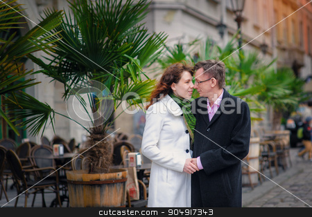 To use this stock image in your creative project, please select the size you need over to the right and click the "Add to Cart" button.
Your downloaded image will come with the Cutcaster watermark removed so don’t worry about the watermark you see on this page. Lovely couple walking in an old European city center stock photo, Lovely couple walking in an old European city center. by timonko