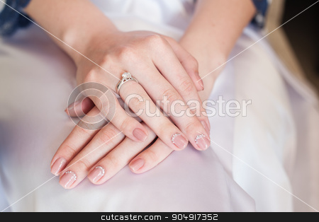 To use this stock image in your creative project, please select the size you need over to the right and click the "Add to Cart" button.
Your downloaded image will come with the Cutcaster watermark removed so don’t worry about the watermark you see on this page. Bride hand with manicure on wedding dress stock photo, Bride hand with manicure on wedding dress. by timonko