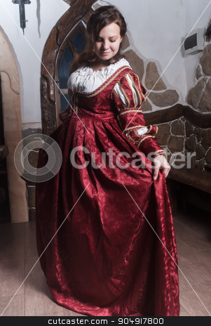 To use this stock image in your creative project, please select the size you need over to the right and click the "Add to Cart" button.
Your downloaded image will come with the Cutcaster watermark removed so don’t worry about the watermark you see on this page. Portrait of elegant woman in medieval era dress stock photo, Portrait of young attractive woman in dress of retro baroque style by Aikon