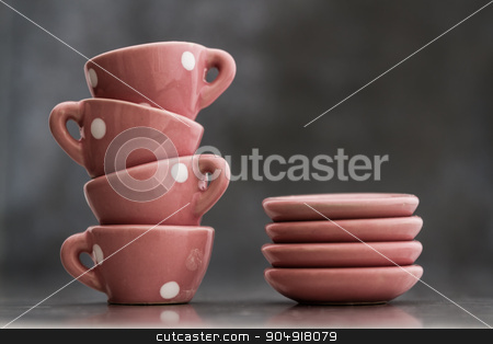To use this stock image in your creative project, please select the size you need over to the right and click the "Add to Cart" button.
Your downloaded image will come with the Cutcaster watermark removed so don’t worry about the watermark you see on this page. Little Pink Toy Porcelain Cups and Plates with White Dots stock photo, Little pink toy porcelain cups and plates with white dots on gray background by OZMedia