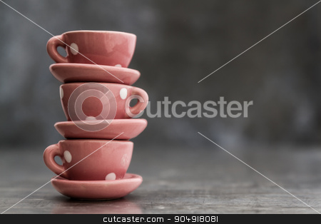 To use this stock image in your creative project, please select the size you need over to the right and click the "Add to Cart" button.
Your downloaded image will come with the Cutcaster watermark removed so don’t worry about the watermark you see on this page. Little Pink Toy Porcelain Cups and Plates with White Dots stock photo, Little pink toy porcelain cups and plates with white dots on gray background by OZMedia