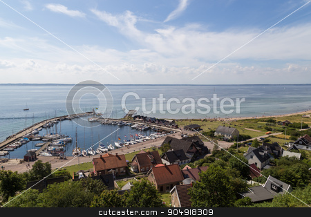 To use this stock image in your creative project, please select the size you need over to the right and click the "Add to Cart" button.
Your downloaded image will come with the Cutcaster watermark removed so don’t worry about the watermark you see on this page. Kyrkbacken harbor on island Ven stock photo, Ven, Sweden - August 06, 2015: Photograph of the small sailing boat harbor in the village Kyrkbacken on island Ven. by Oliver Foerstner