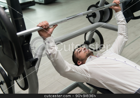 To use this stock image in your creative project, please select the size you need over to the right and click the "Add to Cart" button.
Your downloaded image will come with the Cutcaster watermark removed so don’t worry about the watermark you see on this page. Businessman Exercise Bench Press With Barbell stock photo, Business Man In Gym Exercising Chest On The Bench Press by Jasminko Ibrakovic