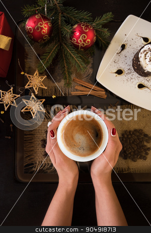 To use this stock image in your creative project, please select the size you need over to the right and click the "Add to Cart" button.
Your downloaded image will come with the Cutcaster watermark removed so don’t worry about the watermark you see on this page. new year coffee stock photo, Hands holding mug of coffee close-up, on new year background by olinchuk