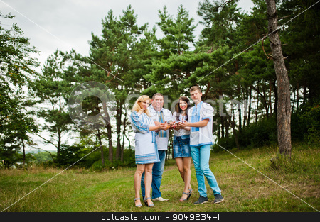 To use this stock image in your creative project, please select the size you need over to the right and click the "Add to Cart" button.
Your downloaded image will come with the Cutcaster watermark removed so don’t worry about the watermark you see on this page. Happy family on pine forest holding cones at hand stock photo, Happy family on pine forest holding cones at hand by Andrii Shevchuk