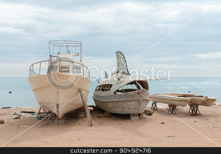 To use this stock image in your creative project, please select the size you need over to the right and click the "Add to Cart" button.
Your downloaded image will come with the Cutcaster watermark removed so don’t worry about the watermark you see on this page. Deserted fishing boats stock photo, Old deserted fishing entertainment boats on the beach of Red Sea by Nikita Buida