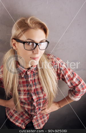 To use this stock image in your creative project, please select the size you need over to the right and click the "Add to Cart" button.
Your downloaded image will come with the Cutcaster watermark removed so don’t worry about the watermark you see on this page. Young beautiful blond woman with glasses stock photo, Student girl in checkered skirt with glasses by sunapple