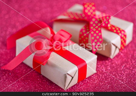 To use this stock image in your creative project, please select the size you need over to the right and click the "Add to Cart" button.
Your downloaded image will come with the Cutcaster watermark removed so don’t worry about the watermark you see on this page. presents stock photo, box for present with red ribbon on the wooden table by tycoon