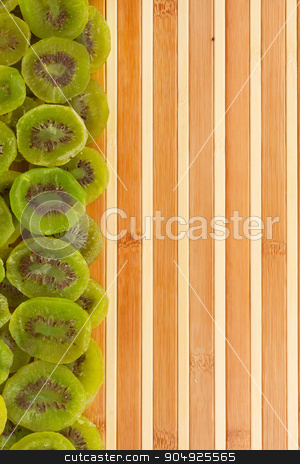 To use this stock image in your creative project, please select the size you need over to the right and click the "Add to Cart" button.
Your downloaded image will come with the Cutcaster watermark removed so don’t worry about the watermark you see on this page. Dried kiwi lying on a bamboo mat stock photo, Dried kiwi lying on a bamboo mat as background by alekleks
