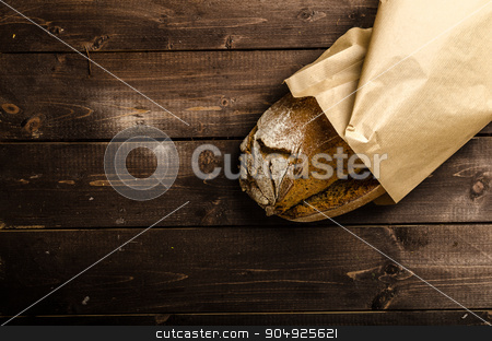 To use this stock image in your creative project, please select the size you need over to the right and click the "Add to Cart" button.
Your downloaded image will come with the Cutcaster watermark removed so don’t worry about the watermark you see on this page. Homemade bread on wood board stock photo, Homemade bread, place for your advertisement, dark picture by Peteer