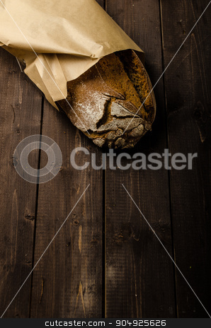 To use this stock image in your creative project, please select the size you need over to the right and click the "Add to Cart" button.
Your downloaded image will come with the Cutcaster watermark removed so don’t worry about the watermark you see on this page. Homemade bread on wood board stock photo, Homemade bread, place for your advertisement, dark picture by Peteer