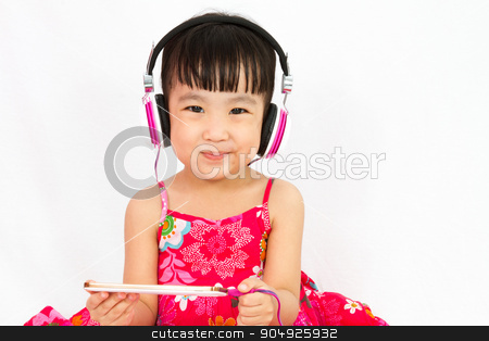 To use this stock image in your creative project, please select the size you need over to the right and click the "Add to Cart" button.
Your downloaded image will come with the Cutcaster watermark removed so don’t worry about the watermark you see on this page. Chinese little girl on headphones holding mobile phone stock photo, Chinese little girl on headphones holding mobile phone in plain isolated white background. by Tan Kian Khoon