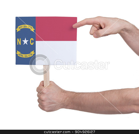 To use this stock image in your creative project, please select the size you need over to the right and click the "Add to Cart" button.
Your downloaded image will come with the Cutcaster watermark removed so don’t worry about the watermark you see on this page. Hand holding small card - Flag of North Carolina stock photo, Hand holding small card, isolated on white - Flag of North Carolina by michaklootwijk