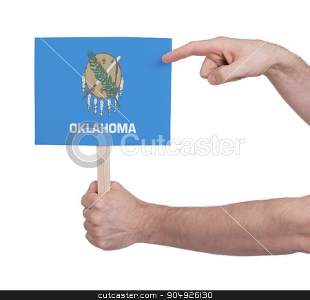 To use this stock image in your creative project, please select the size you need over to the right and click the "Add to Cart" button.
Your downloaded image will come with the Cutcaster watermark removed so don’t worry about the watermark you see on this page. Hand holding small card - Flag of Oklahoma stock photo, Hand holding small card, isolated on white - Flag of Oklahoma by michaklootwijk