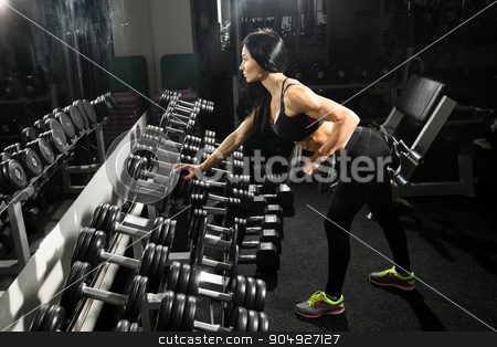 To use this stock image in your creative project, please select the size you need over to the right and click the "Add to Cart" button.
Your downloaded image will come with the Cutcaster watermark removed so don’t worry about the watermark you see on this page. sexy woman doing workout with dumbbells in gym. exercise for the back and triceps stock photo, Nice sexy woman doing workout with dumbbells in gym by Kopytin Georgy