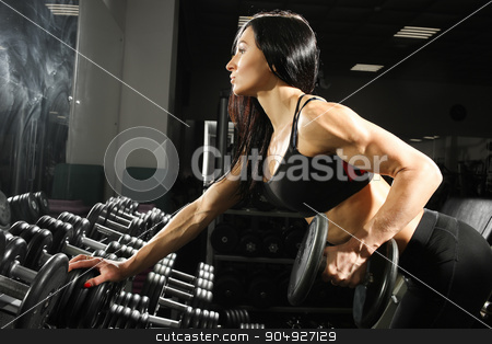 To use this stock image in your creative project, please select the size you need over to the right and click the "Add to Cart" button.
Your downloaded image will come with the Cutcaster watermark removed so don’t worry about the watermark you see on this page. sexy woman doing workout with dumbbells in gym. exercise for the back and triceps stock photo, Nice sexy woman doing workout with dumbbells in gym by Kopytin Georgy