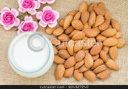 To use this stock image in your creative project, please select the size you need over to the right and click the "Add to Cart" button.
Your downloaded image will come with the Cutcaster watermark removed so don’t worry about the watermark you see on this page. Almond and milk in glass with flower. stock photo, Almond and milk in glass with flower on sack background. by Miss. PENCHAN PUMILA